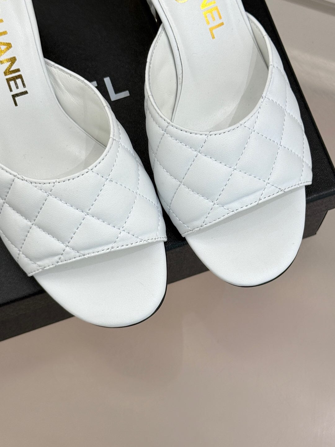 2025 Women Chanel White Lambskin Quilted Heeled Slippers